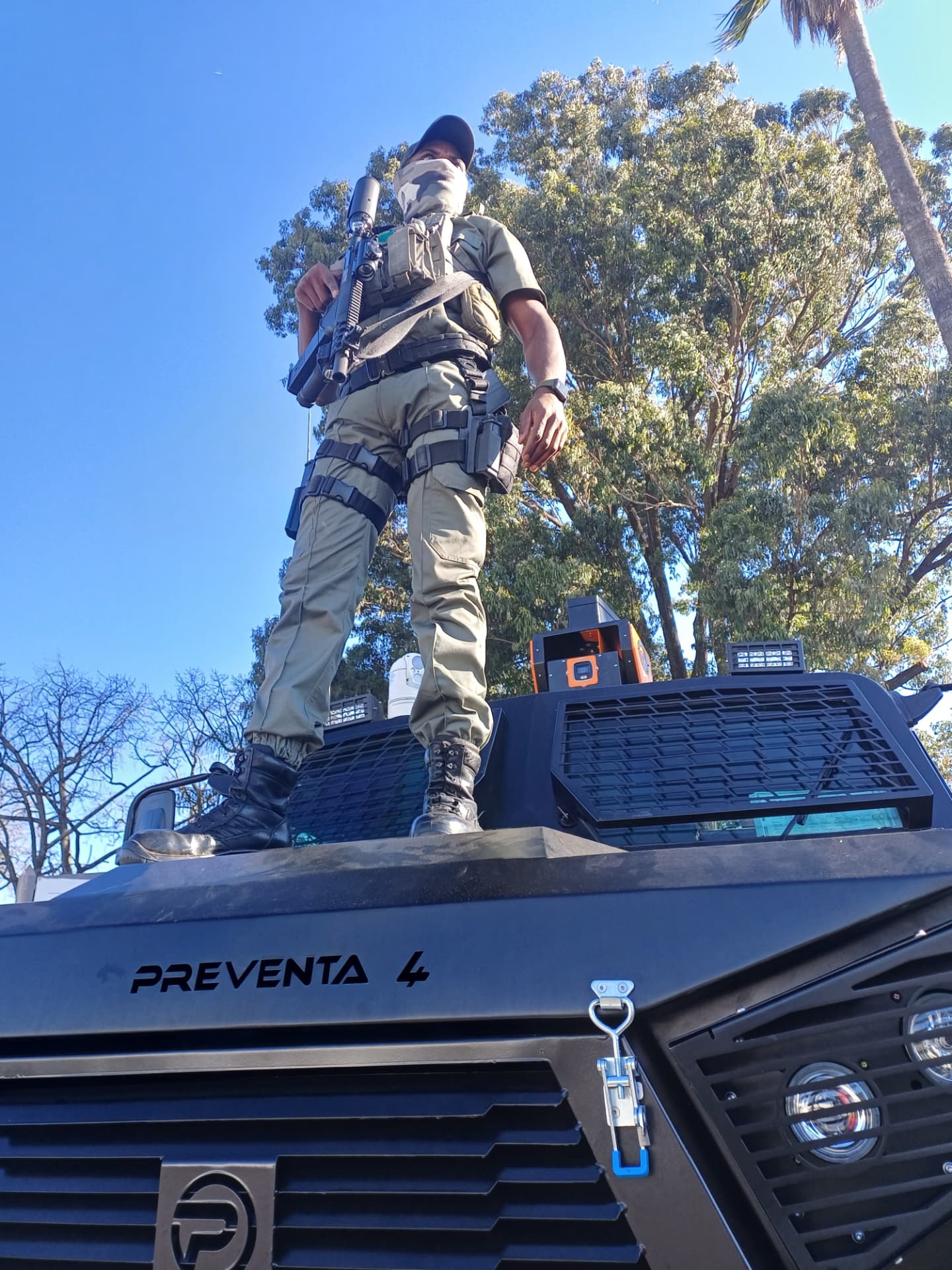 Operator standing on a Preventa 4 armoured vehicle