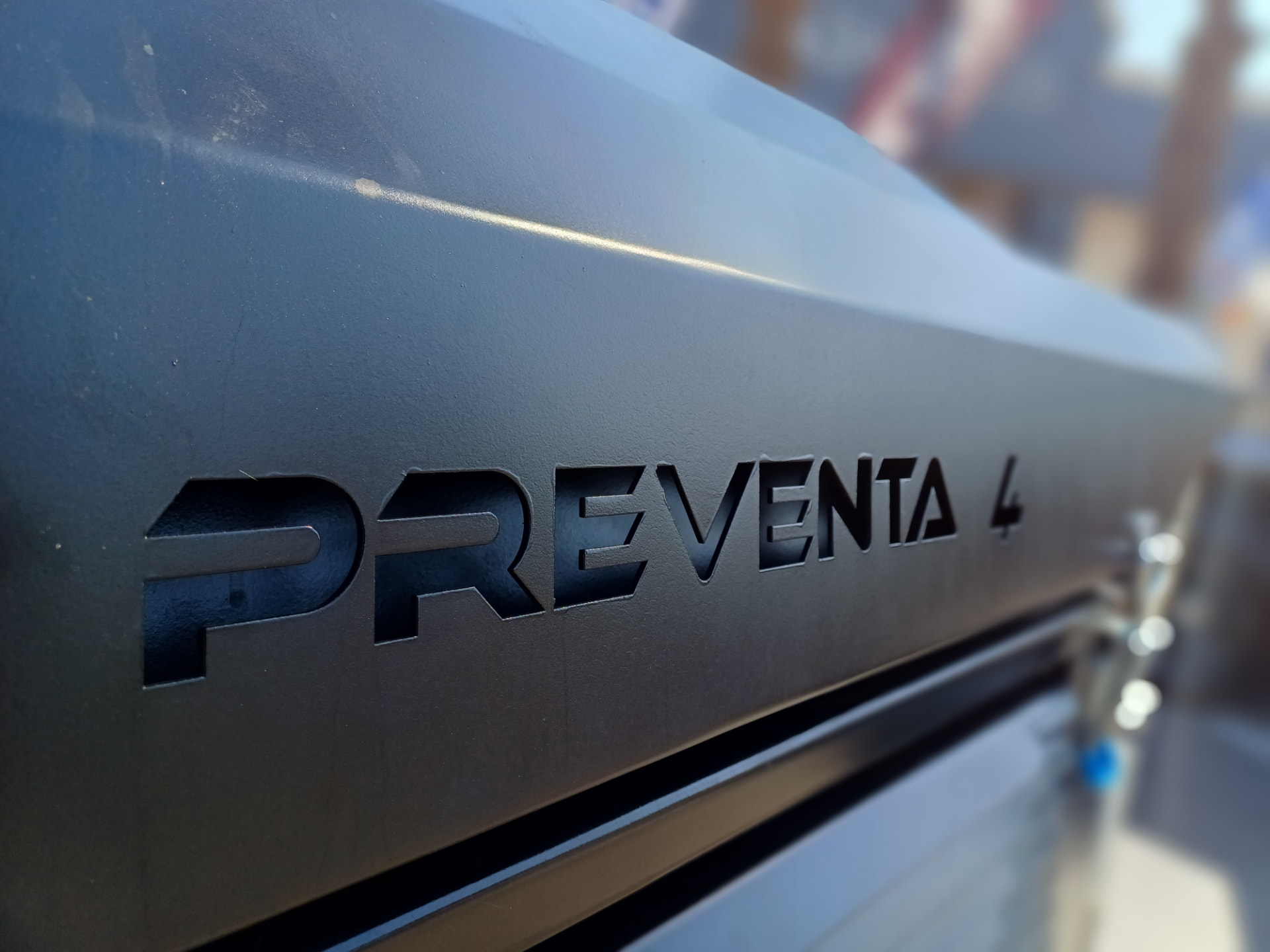 Preventa 4 badge embossed on an armoured body panel